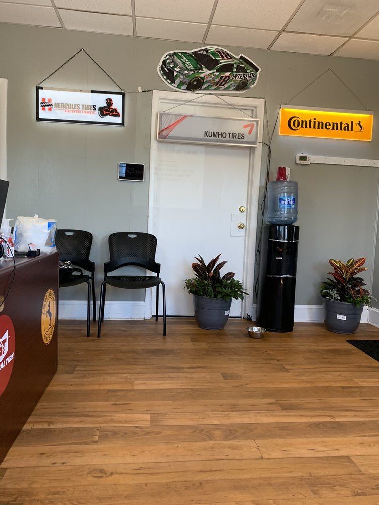 Waiting area with chairs, plants and a water cooler